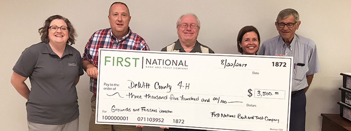 dewitt county 4h foundation receiving large check