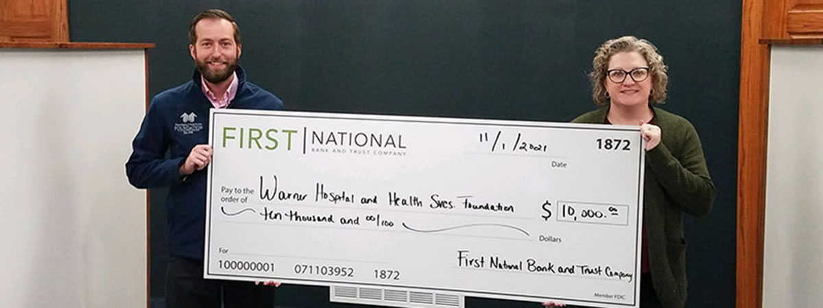 FNBT employees holding check donation