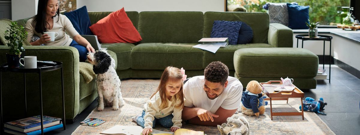 Mom watching daughter and dad play