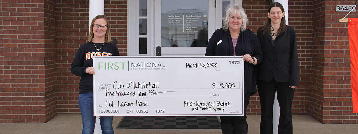 First National Bank employees gifting check to the City