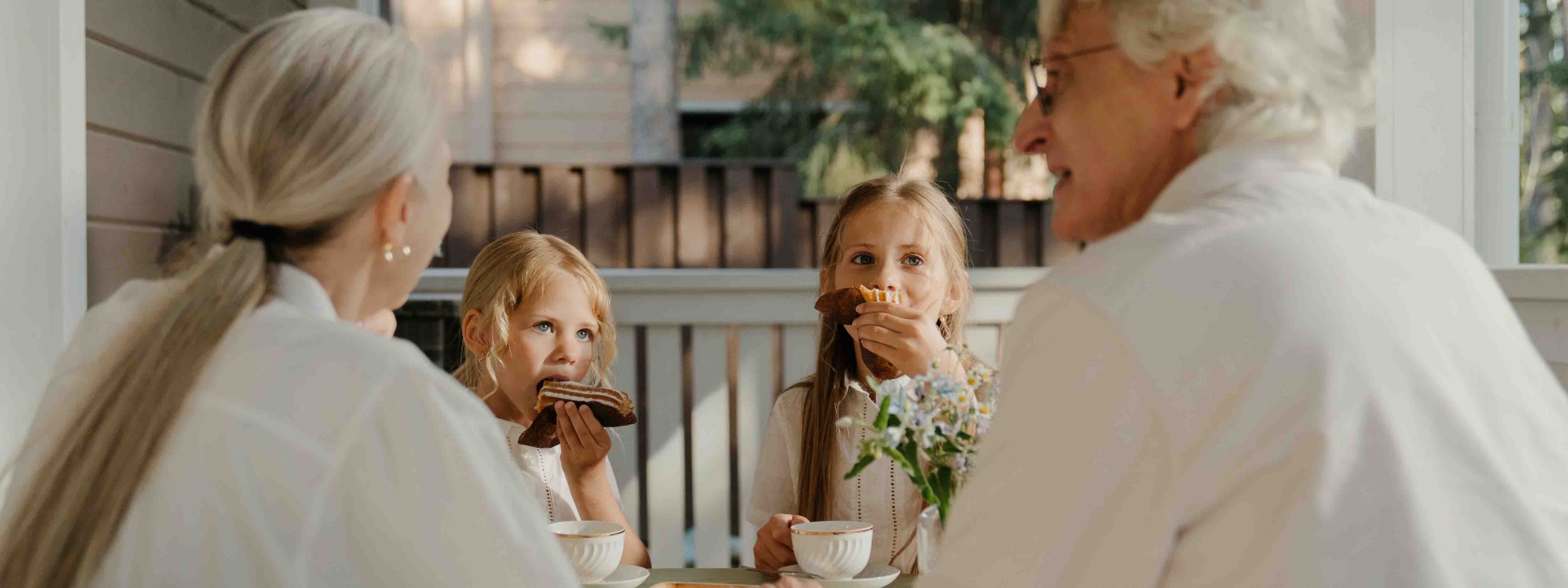 Grandparents eating with their grandchildren