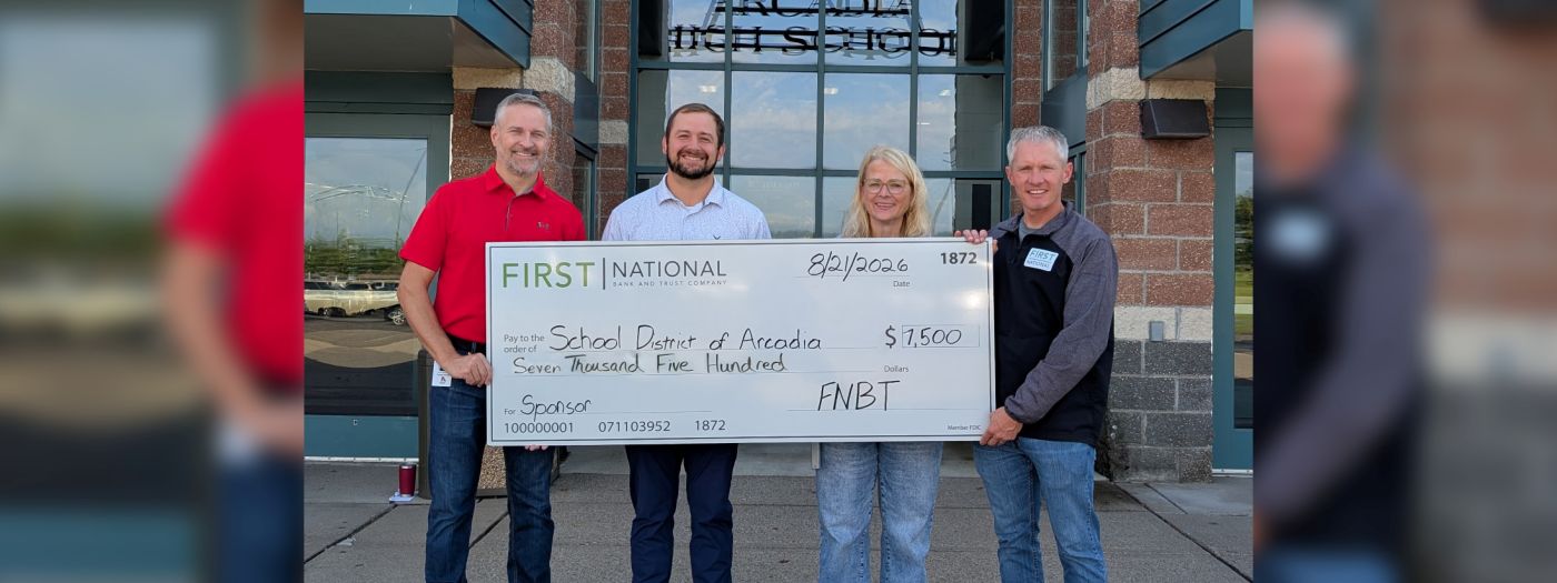 FNBT employees gift check to school district of Arcadia