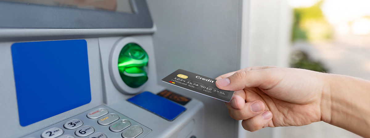 Debit card being used at an ATM