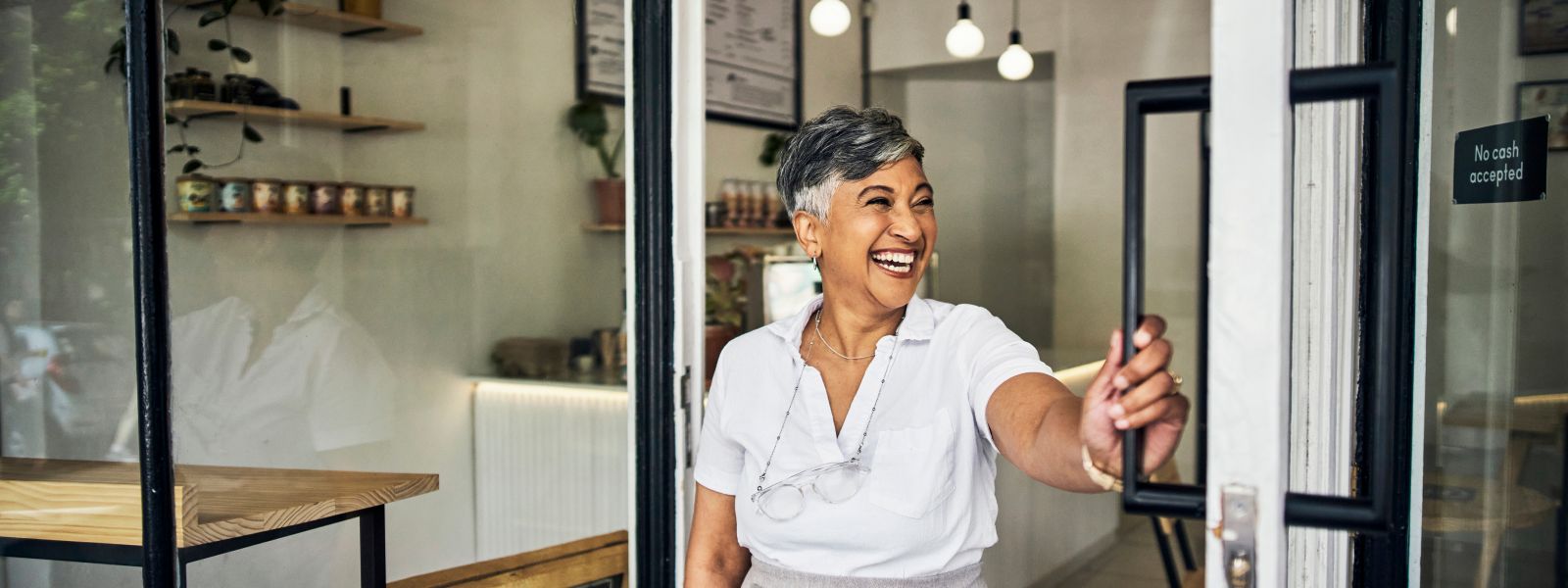 woman holding door open