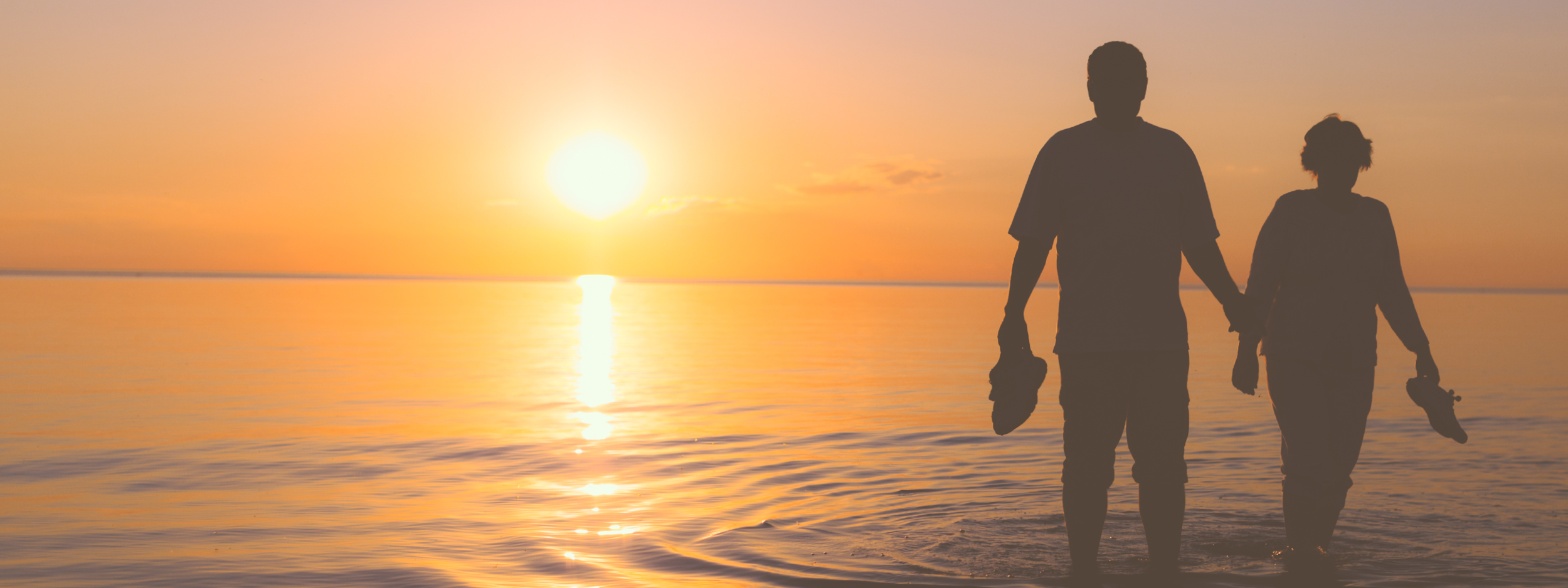 Couple walking in the sunset