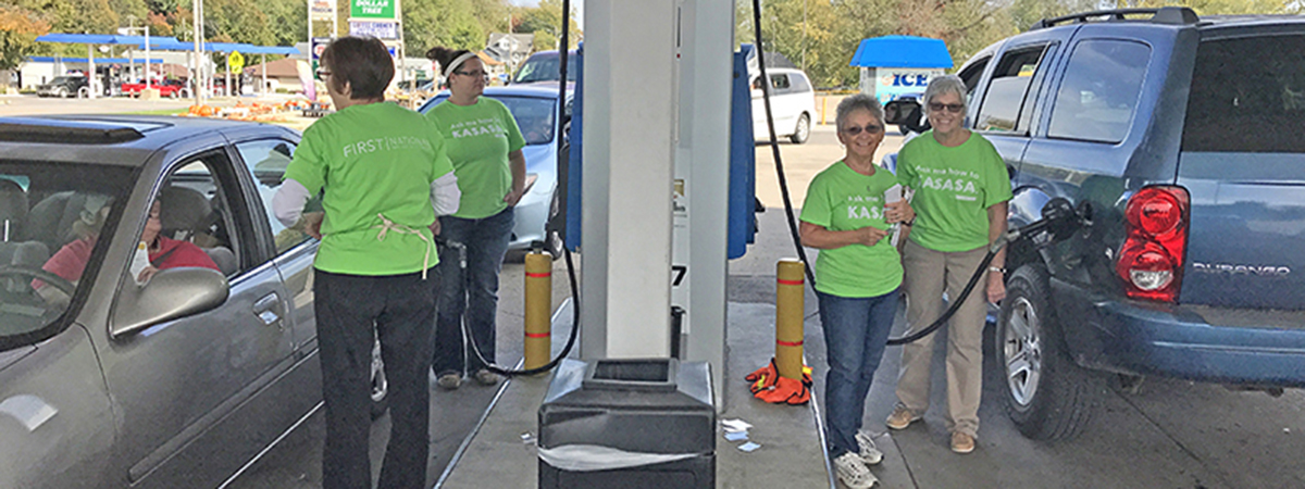 FNBT employees help customers pump gas