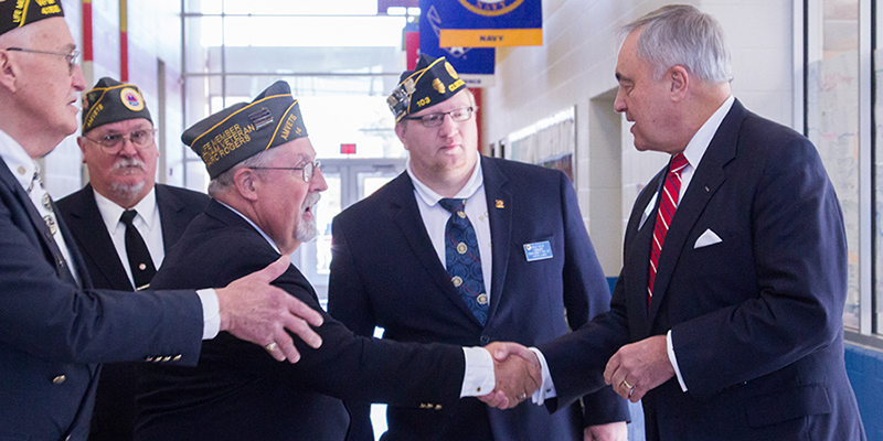 mick shaking hands with veterans