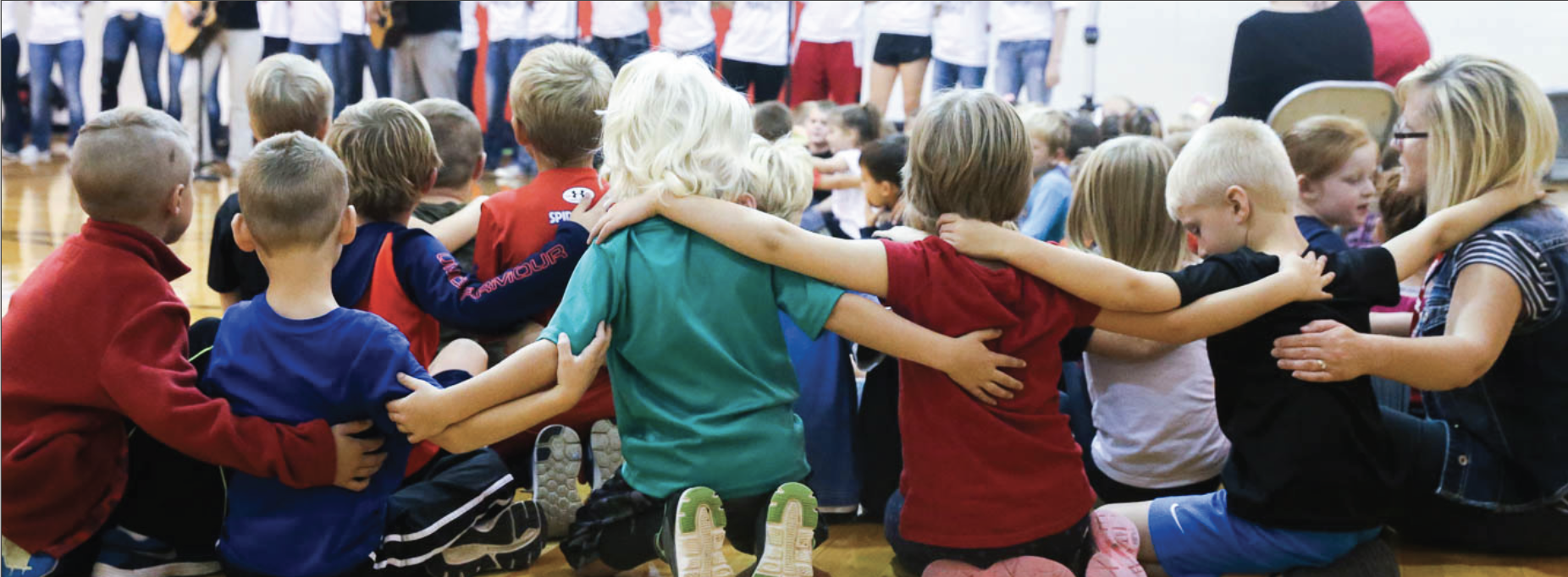 TS Bank Nonprofit Business products and services children huddled with arms around one another